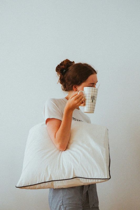 woman in white t-shirt reading book