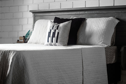 a bed with pillows
