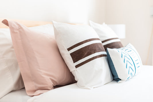 a couple of pillows on a bed