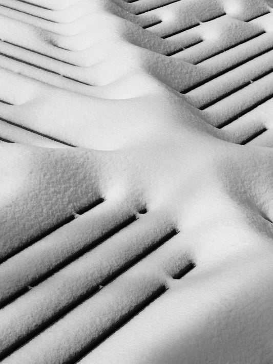 Snow covering parallel lines on a surface